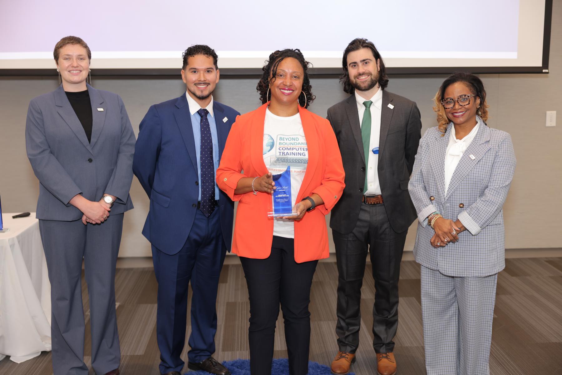 Shaelyn Otikor-Miller receiving her Amplifier Award with the Digital Equity Team